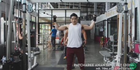 A tomboy, Patcharee Anantaveerat, weight training in the gym, showing off biceps and hairy armpit.